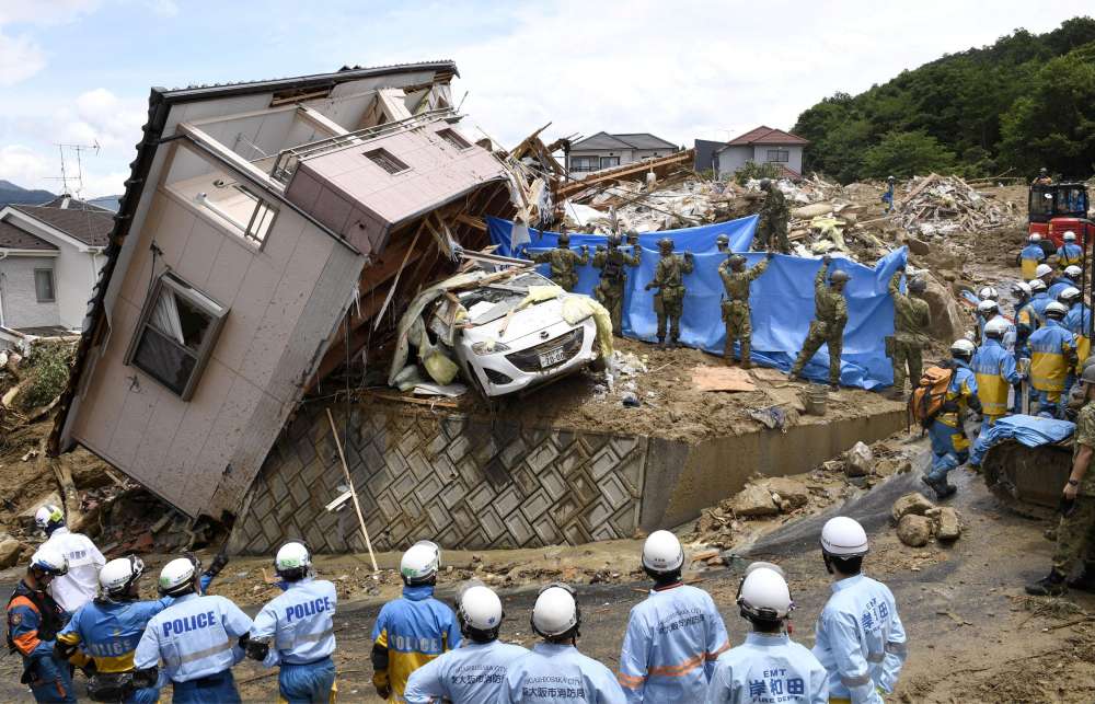 Rescuers race to find survivors after Japan floods kill over 100