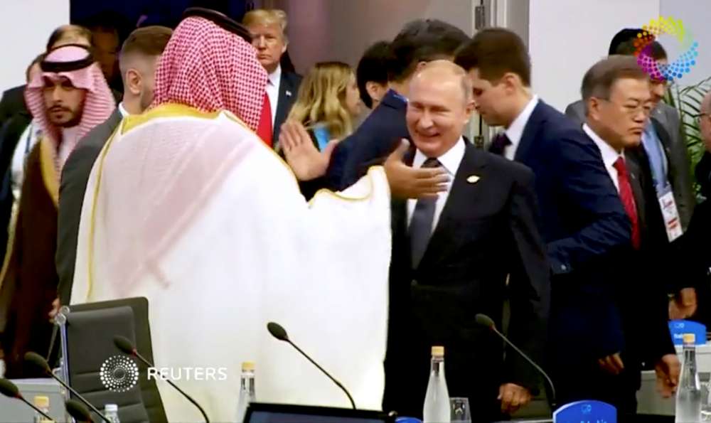 A high-five from Putin and that awkward photograph - Saudi prince's G20 summit