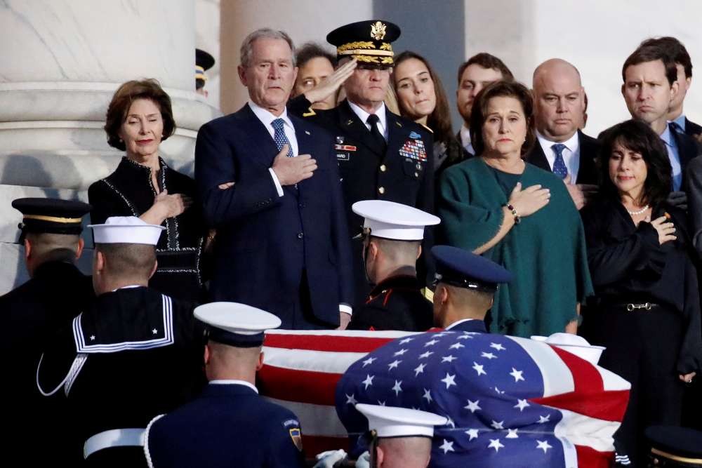 Washington pays respects to Bush as he lies in state at Capitol