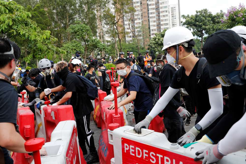 Hong Kong police fire tear gas during another weekend of protests