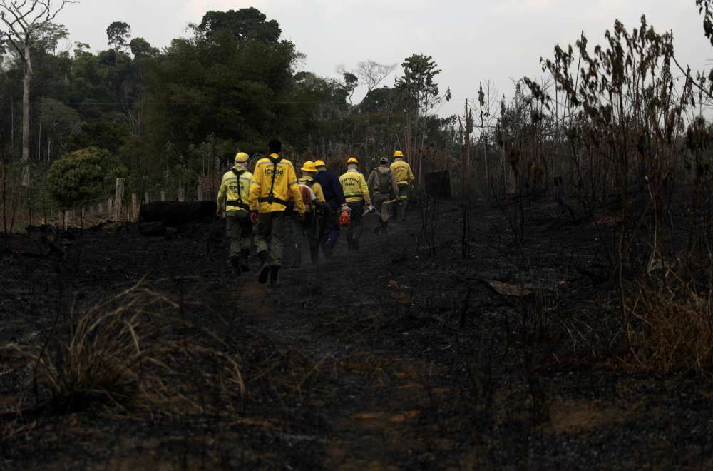 Warplanes dump water on Amazon as Brazil military begins fighting fires