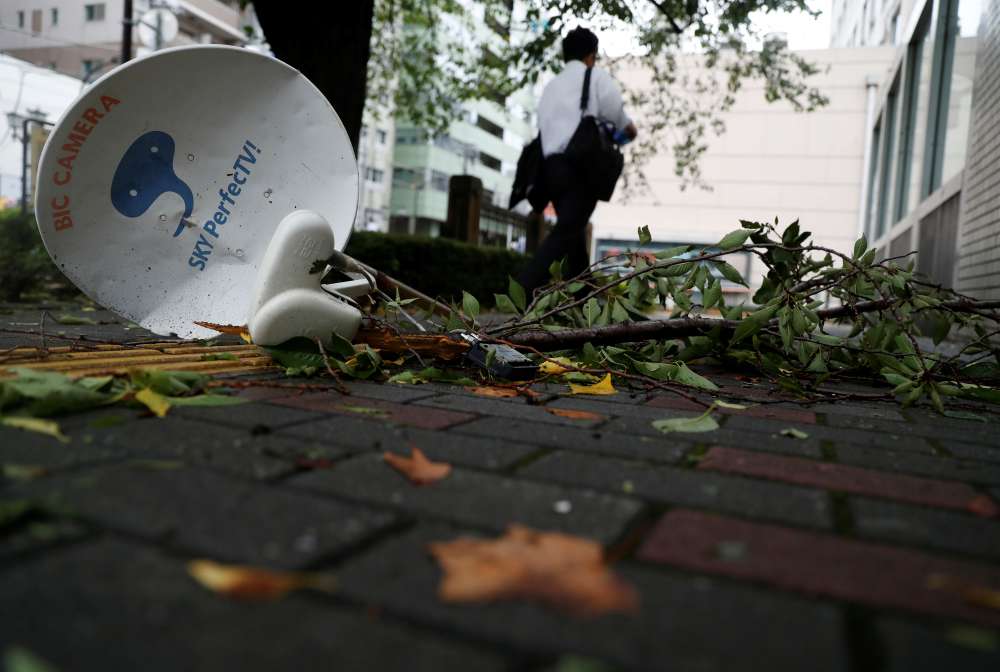 Woman killed as strong typhoon lashes Tokyo area