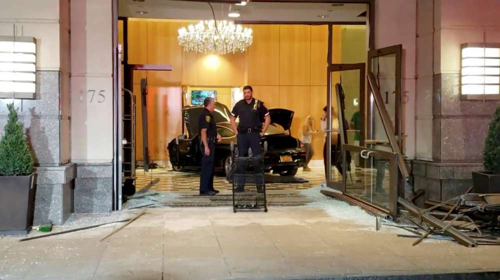 Three people injured when car smashes into Trump Plaza lobby in New York suburb