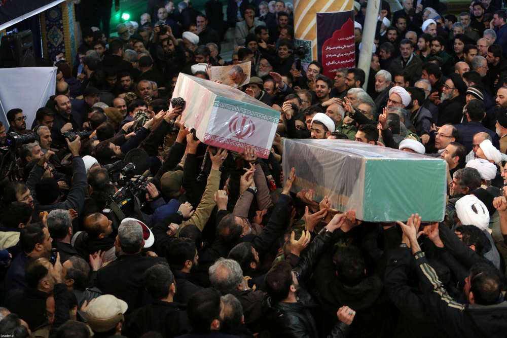 Iran's leader Khamenei leads huge crowds and weeps at commander's funeral