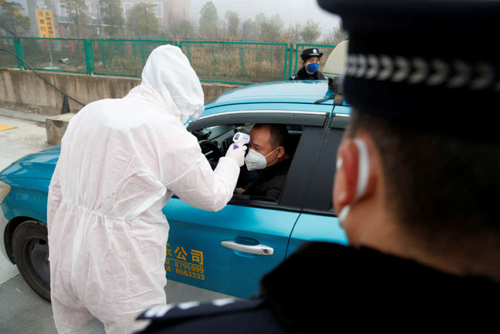 China records first virus death in Beijing as toll passes 100