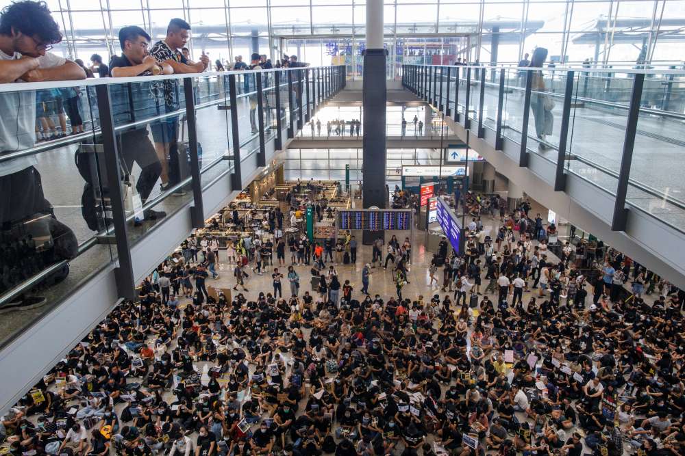 Hundreds of protesters stage sit-in at Hong Kong airport