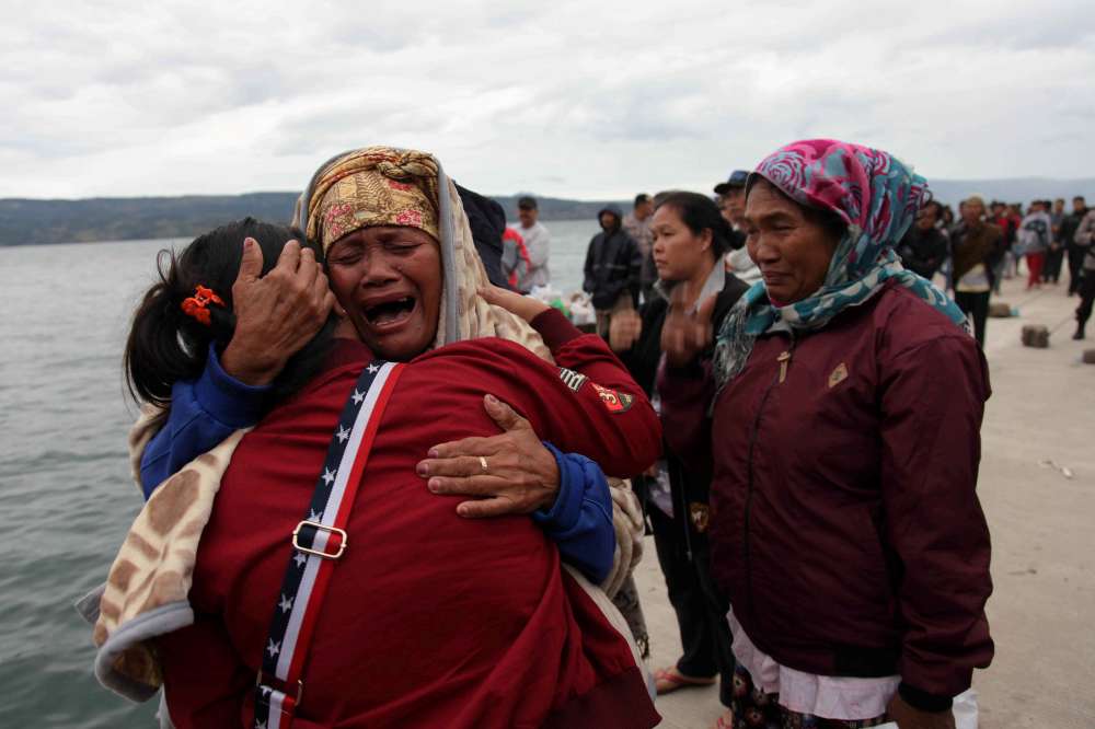 Rescuers hunt for victims of ferry disaster on Indonesian supervolcano lake