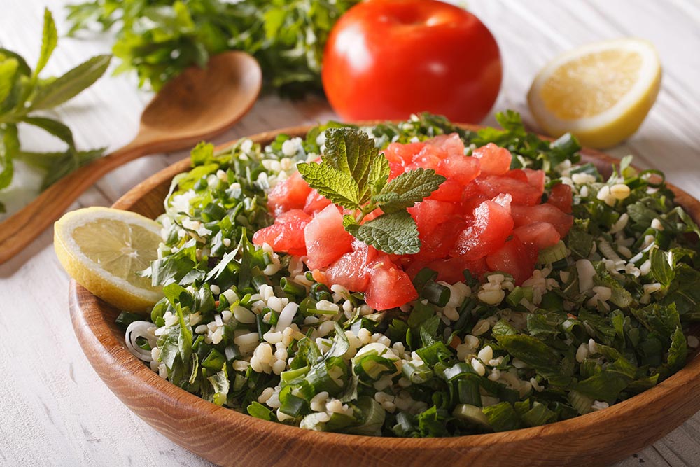 Lebane food. Tabbouleh - lebanese-arabic food, salad with garlic and tomato.