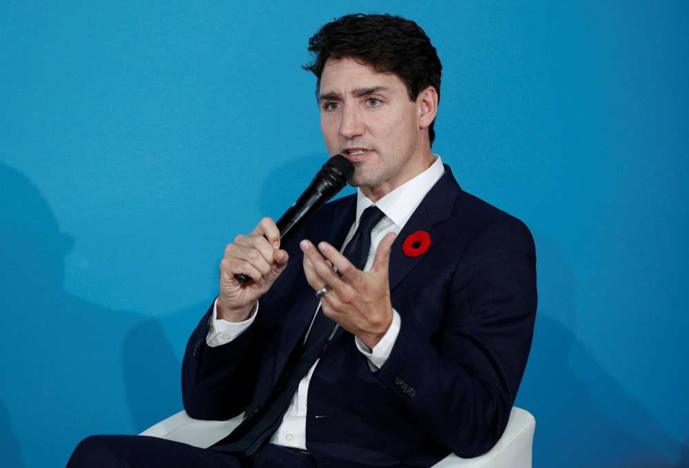 Canada's Trudeau clings to power