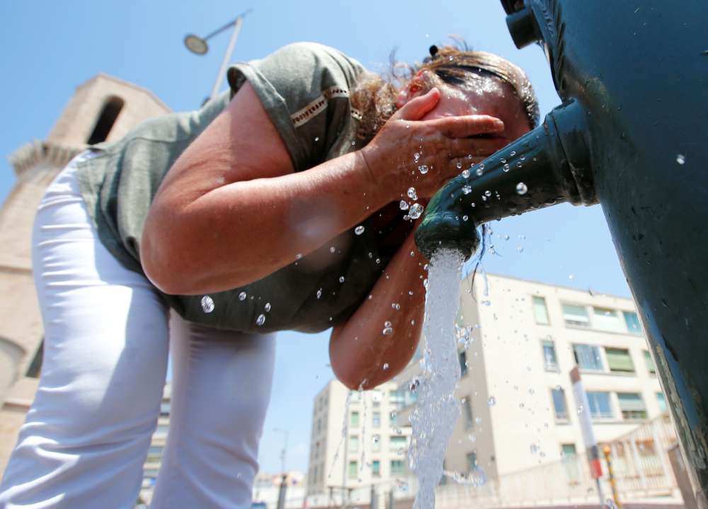 Wildfires and power cuts plague Europe as heatwave breaks records