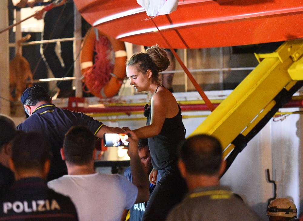 Italian police arrest migrant-rescue ship captain after docking