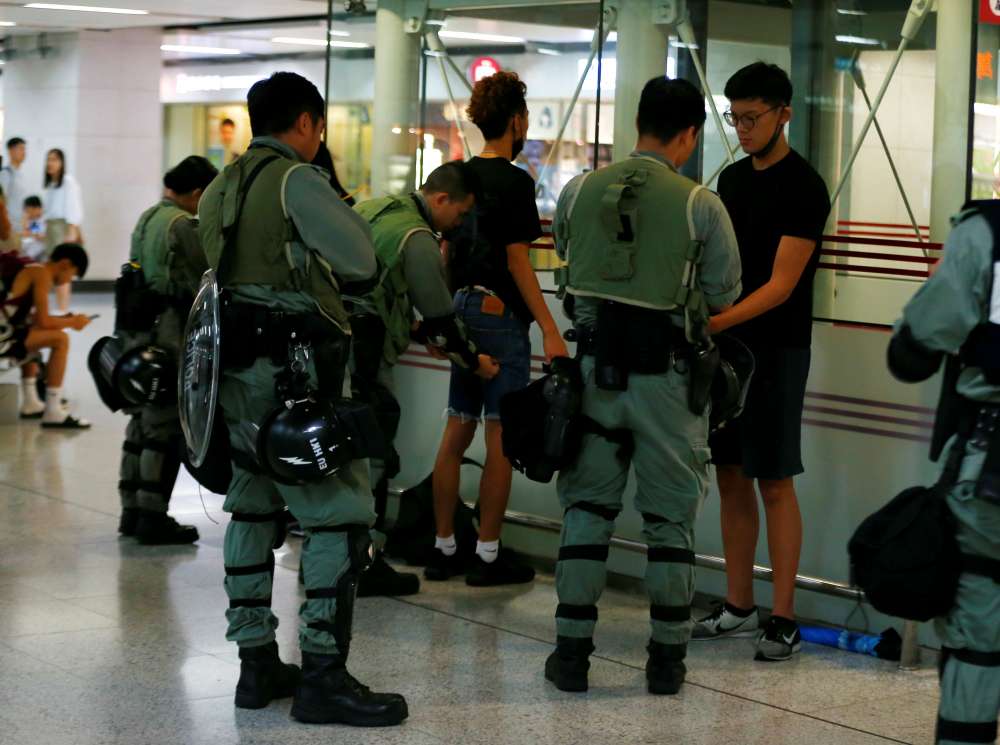 Hong Kong police in position at airport ahead of planned protest