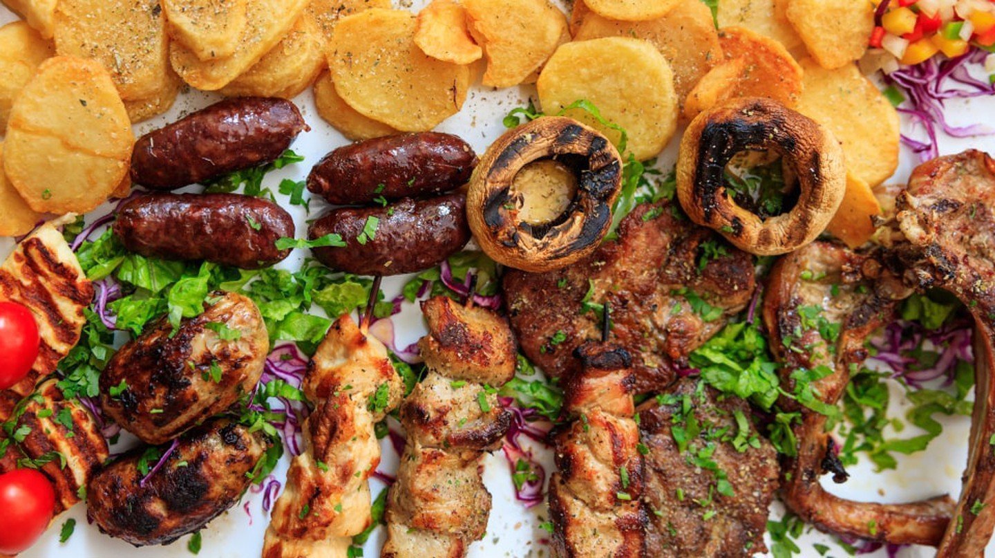 Cypriot mixed grilled meat with vegetables and potatoes