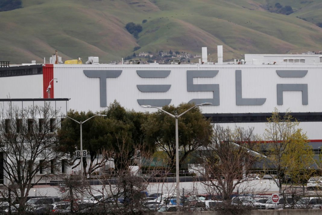 tesla sues california county in virus factory closure fight threatens to leave