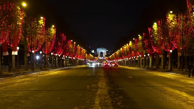 Champs Elysees Avenue In Paris Lights Up In Red For End Of Year Festivities