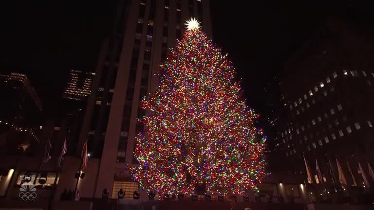 Crowds Return As Rockefeller Center Christmas Tree Lights Up New York