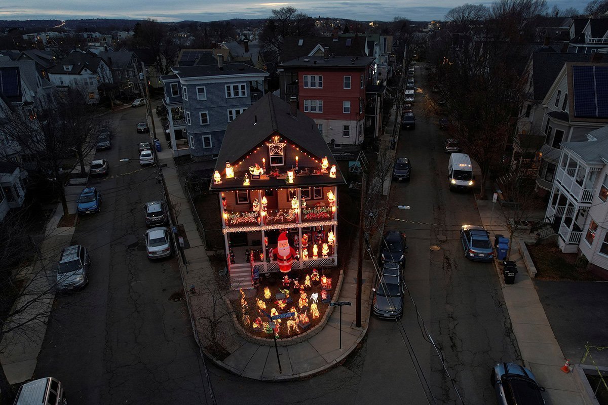 A House Is Covered In Lights For The Christmas Season In Somerville