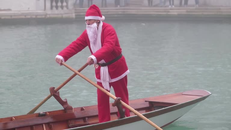 Dozens Of Santa Claus Take Over Venice's Canal In Christmas Regatta