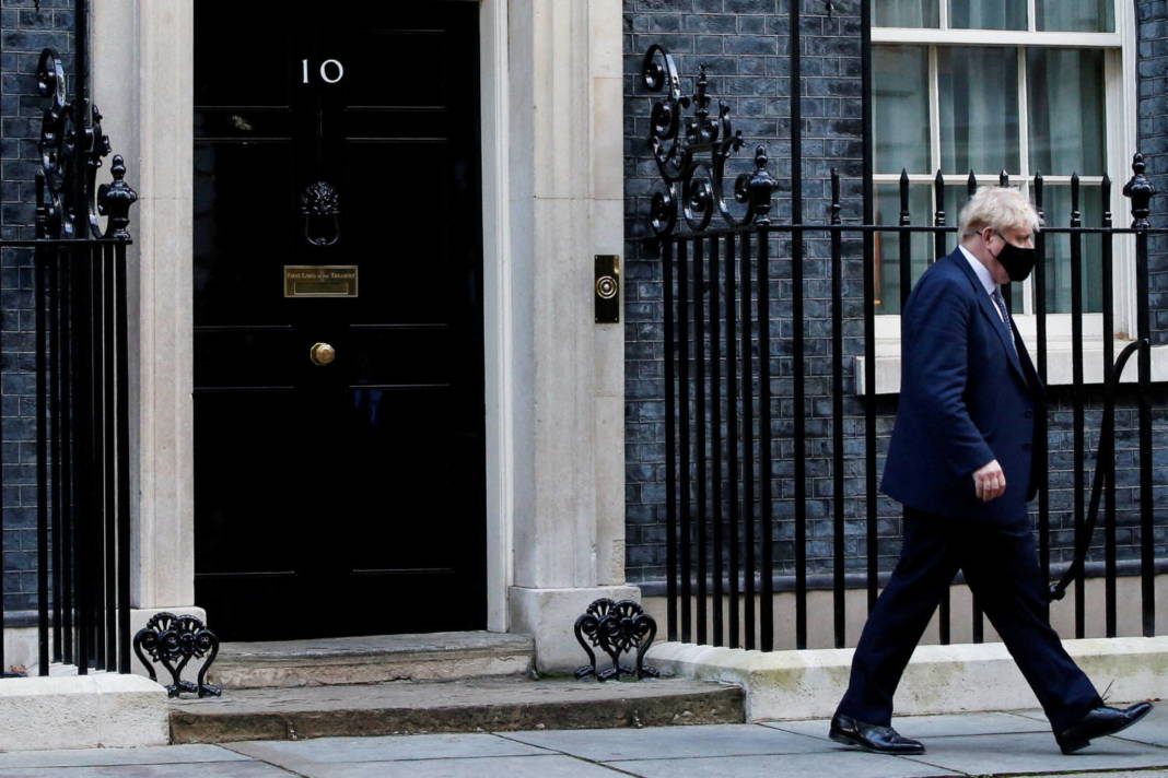 File Photo: British Prime Minister Johnson Walks Outside Downing Street In London