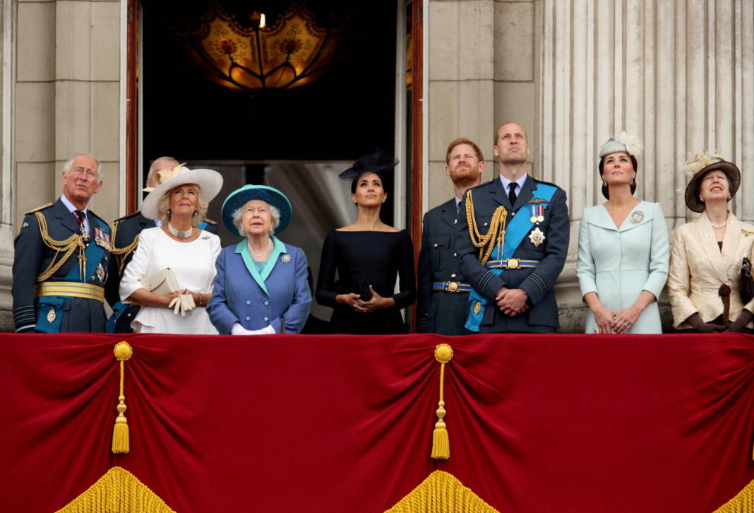 File Photo: Britain's Queen Elizabeth Is Joined By Members Of The Royal Family On The Balcony Of Buckingham Palace As They Watch A Fly Past To Mark The Centenary Of The Royal Air Force In Central London