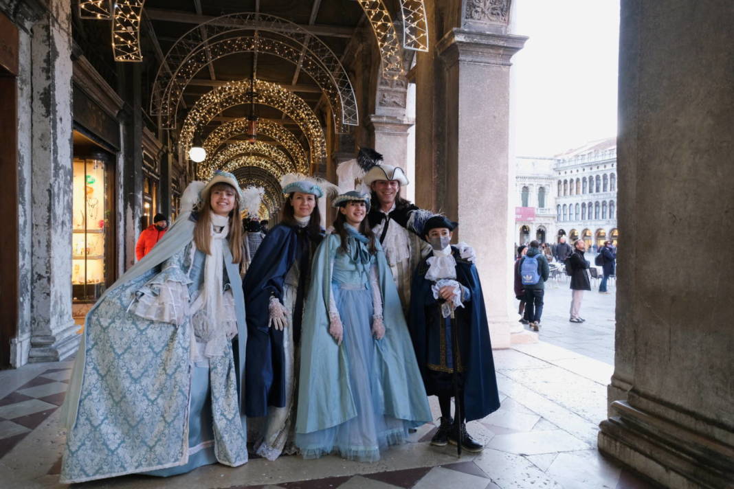 Revellers Wear Carnival Masks And Costumes To Celebrate The Venice Carnival, In Venice