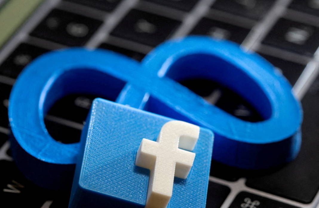 File Photo: A 3d Printed Logo Of Facebook Sits Atop Logo Of Facebook Parent Meta In This Photo Illustration