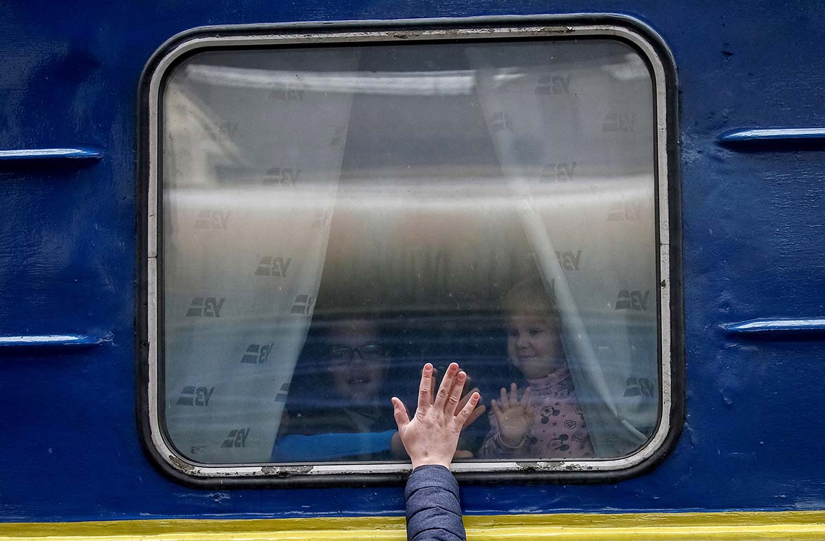 People Wait To Board An Evacuation Train At Kyiv Central Train Station