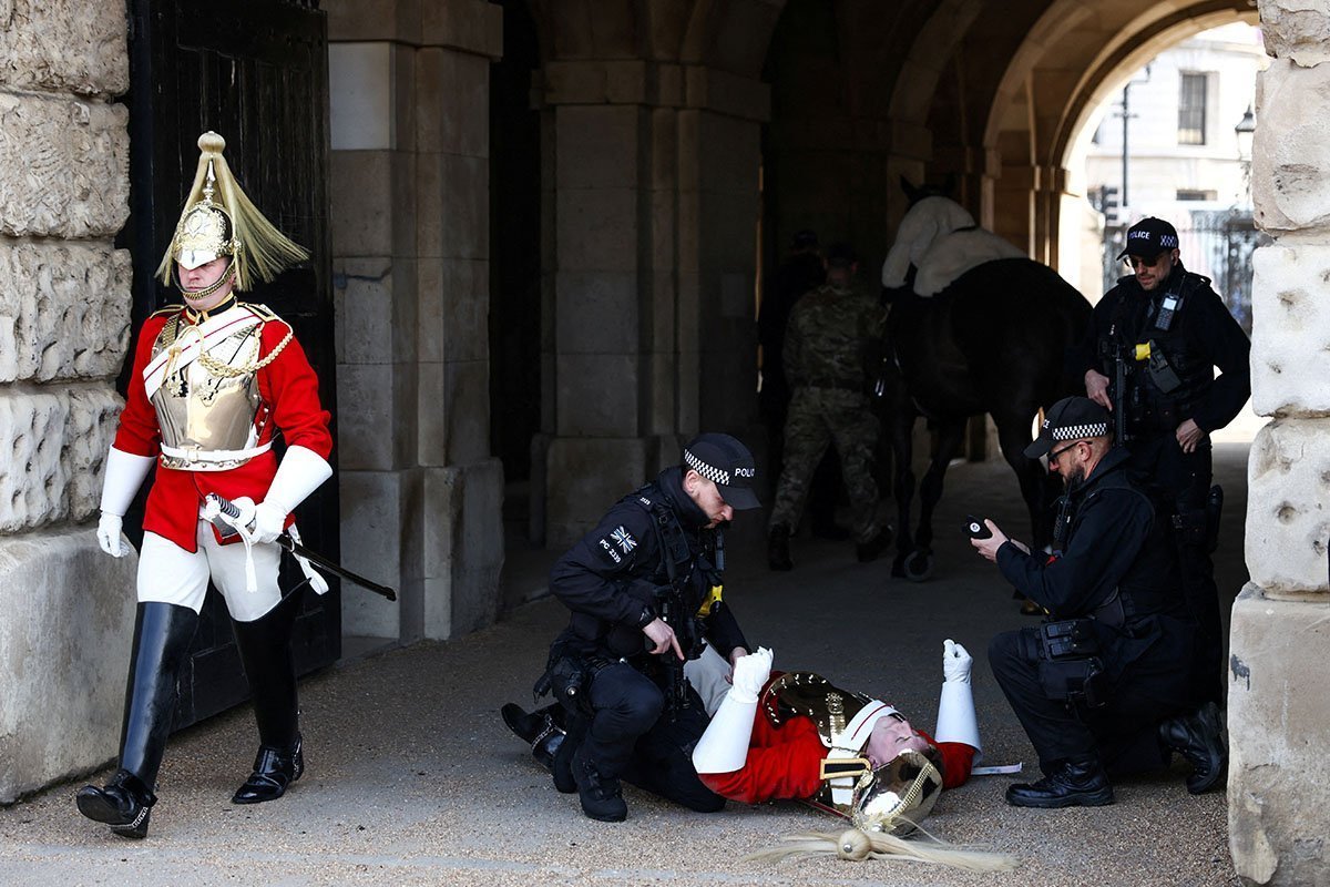 A Member Of The Household Cavalry Lies On The Ground In London