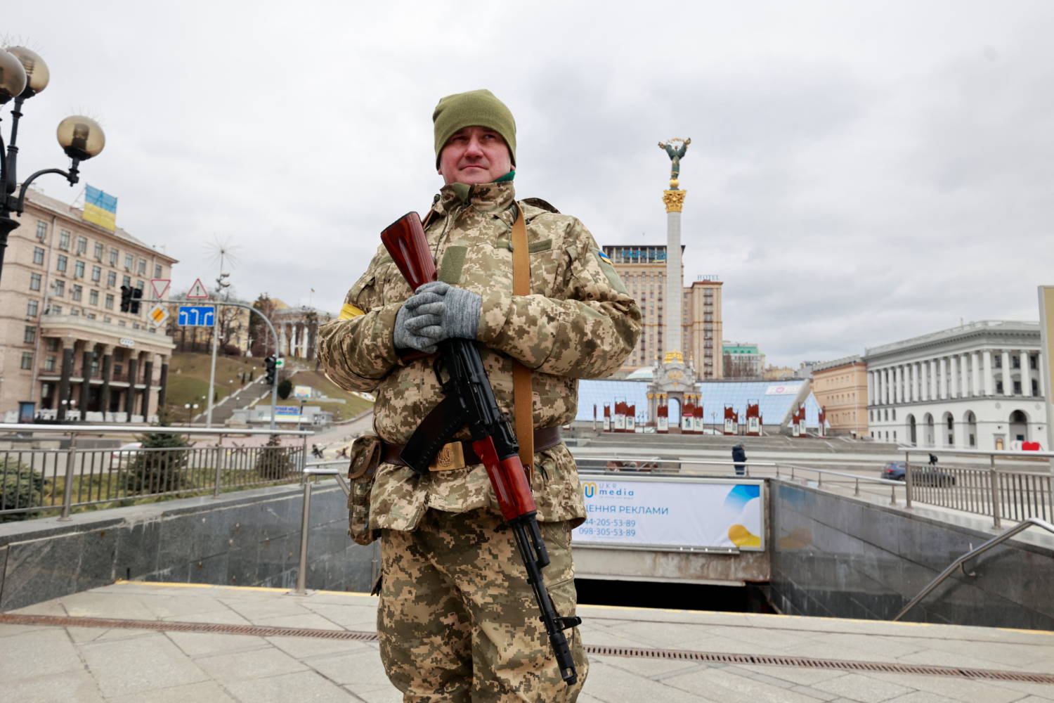 A Ukrainian Service Member Stands Guard At A Checkpoint In Kyiv