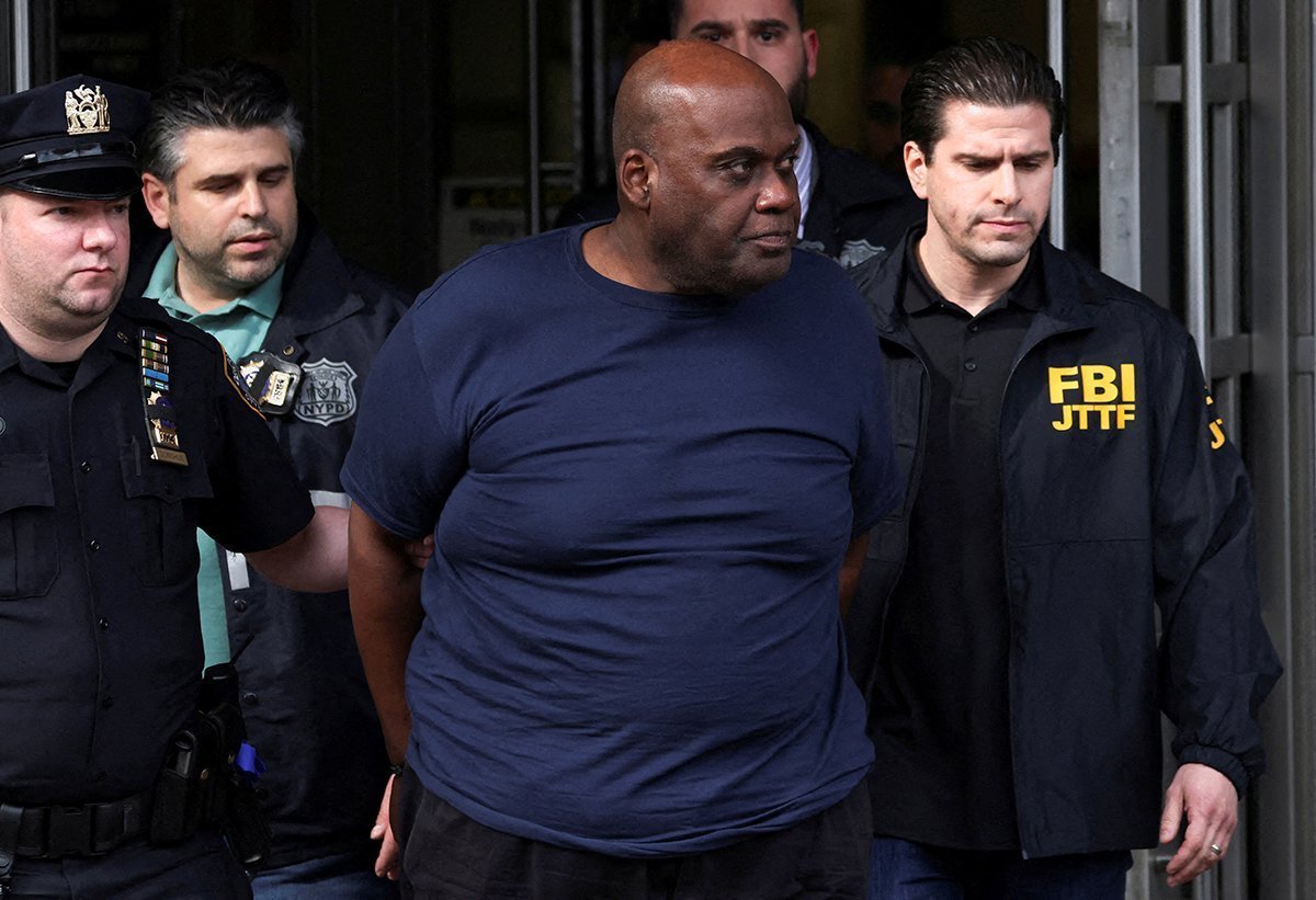 Frank James, The Suspect In The Brooklyn Subway Shooting Walks Outside A Police Precinct In New York City