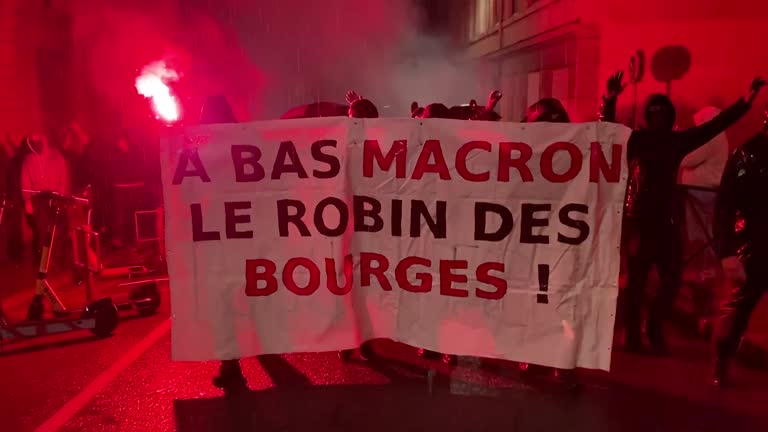 Protests Break Out In Paris, Lyon As France's Macron Re Elected