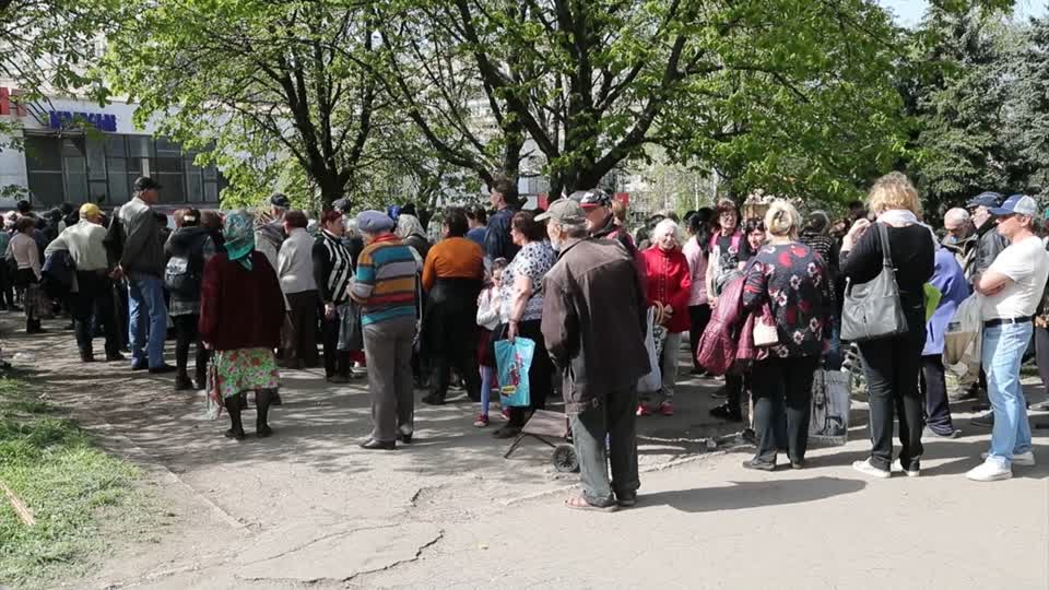 People Line Up To Receive Pensions In Devastated Mariupol