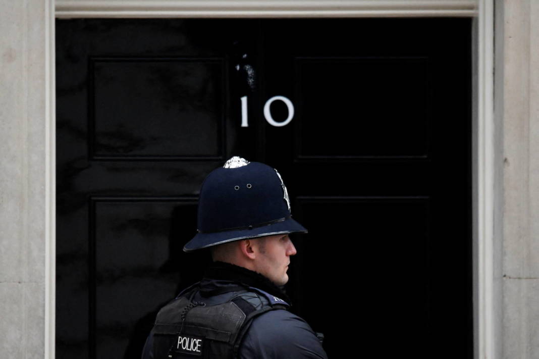 A Police Officer Stands On Duty Outside 10 Downing Street In London