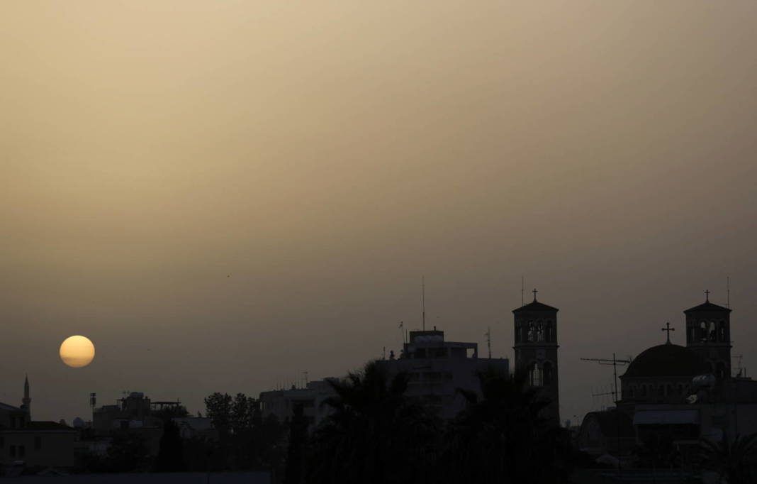 The Sun Sets During A Haze Caused By A Dust Storm In Nicosia