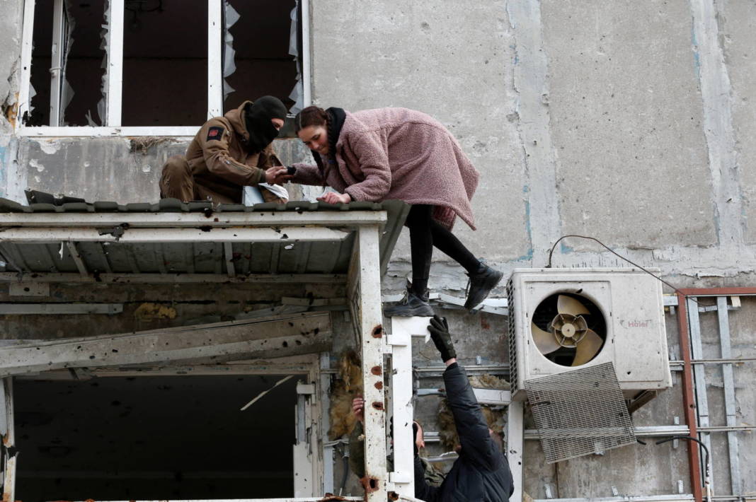 People Take Belongings Out Of A Destroyed Building In Mariupol
