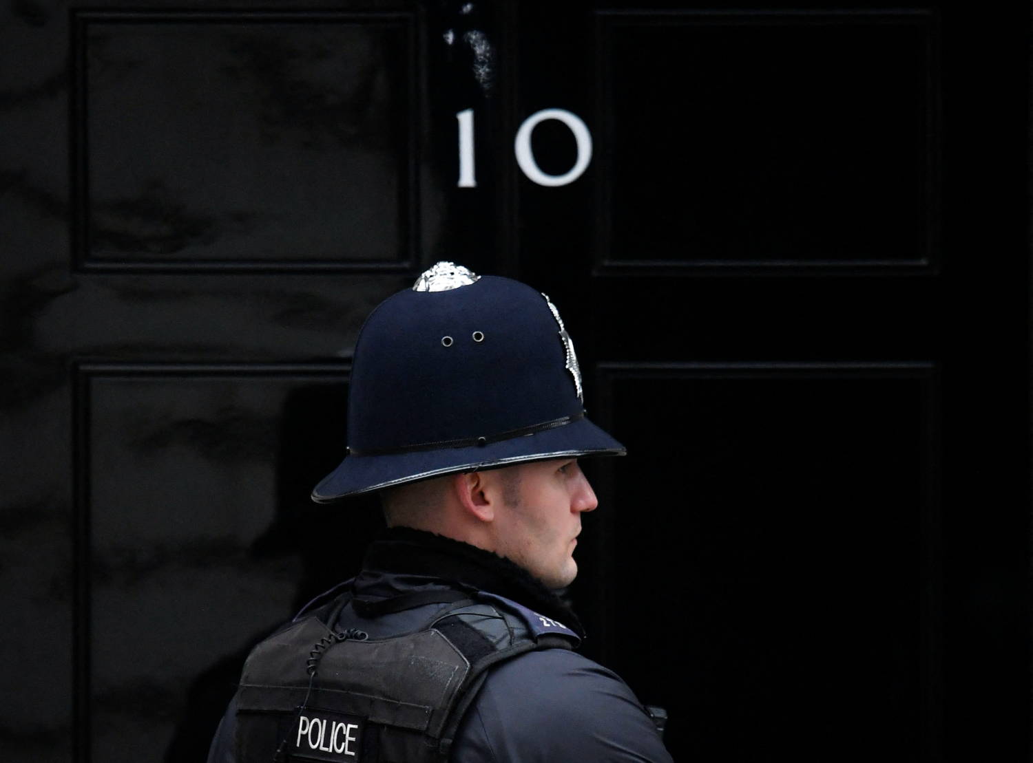 A Police Officer Stands On Duty Outside 10 Downing Street In London