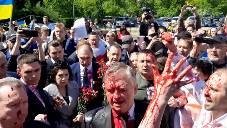 Russian Ambassador Doused In Red By Anti War Protesters In Poland