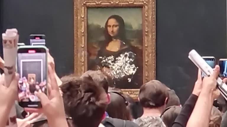 Watch: Mona Lisa Smeared In Cream In Climate Protest Attack