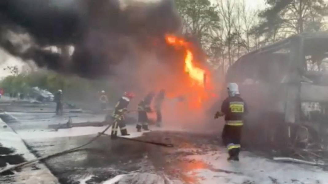 Firefighters Spray Water Onto A Vehicle On Fire After A Fuel Truck Collided With A Bus On The Kyiv Chop Highway In Sitne, Dubna District, Rivne Region