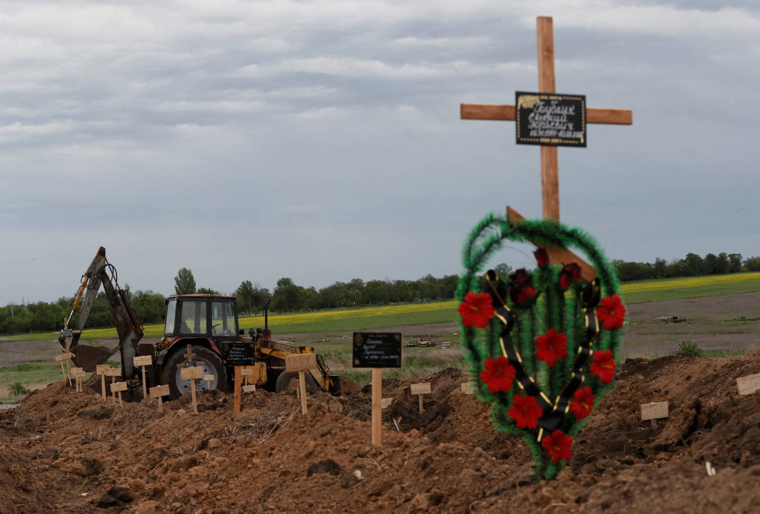 A View Shows Newly Made Graves At A Cemetery Outside Mariupol