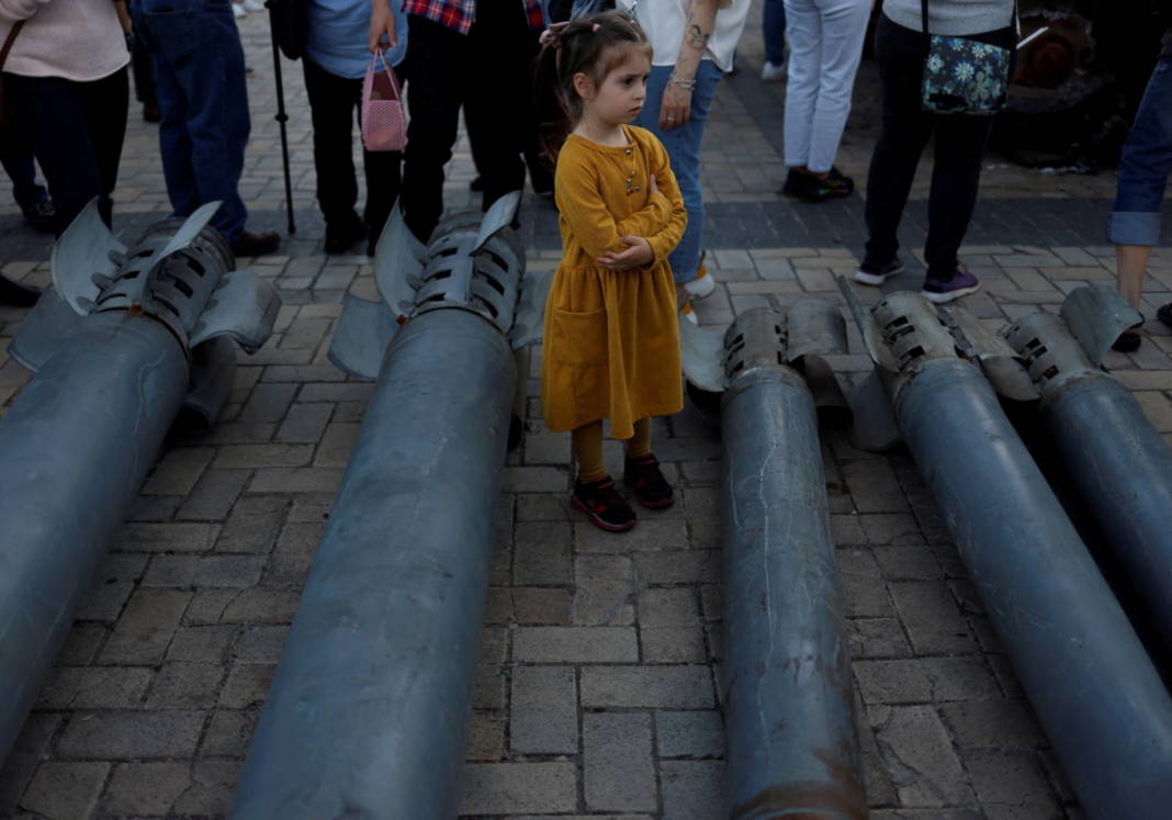 A Girl Looks On At A Display Of Russian Weapon Systems Used In Their Attacks, Outside St Michael's Cathedral, As Russia's Attack On Ukraine Continues, In Kyiv