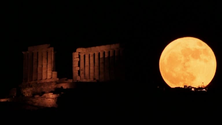 Drone Shows 'strawberry' Supermoon Behind Ancient Greek Temple