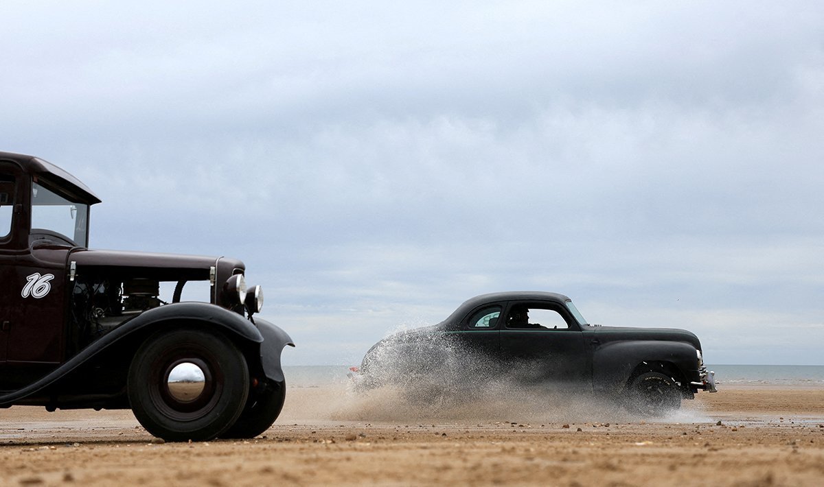 Motoring Enthusiasts Take Part In The 'race The Wave' Classic Car Meet On The Beach At Bridlington, Britain