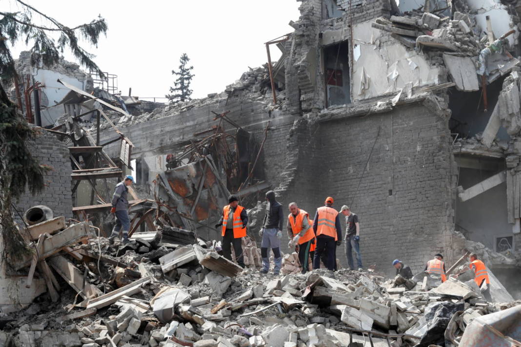 File Photo: People Remove The Debris Of A Theatre Building In Mariupol