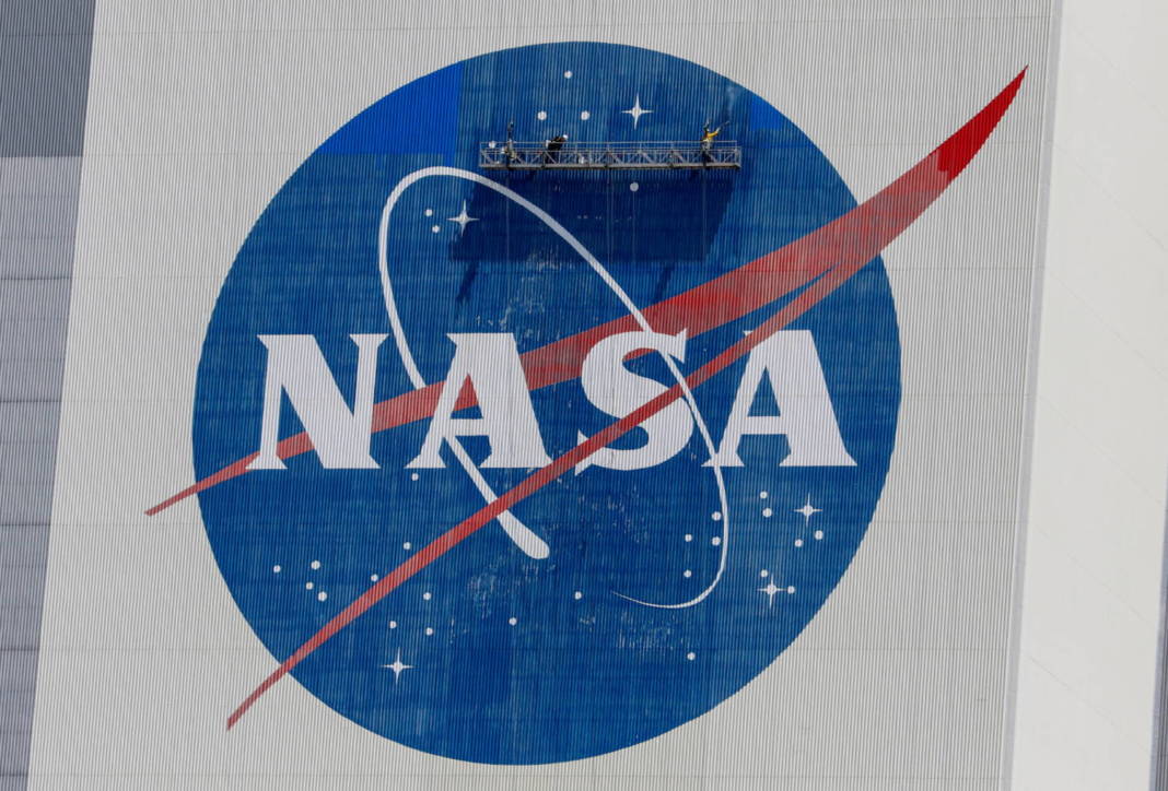 File Photo: Workers Pressure Wash The Logo Of Nasa On The Vehicle Assembly Building, In Cape Canaveral