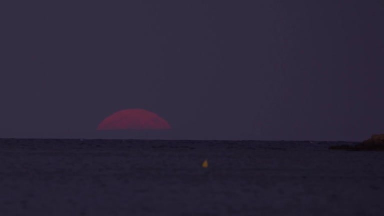 Largest Supermoon Of The Year Casts Crimson Glow Over Greek Coast