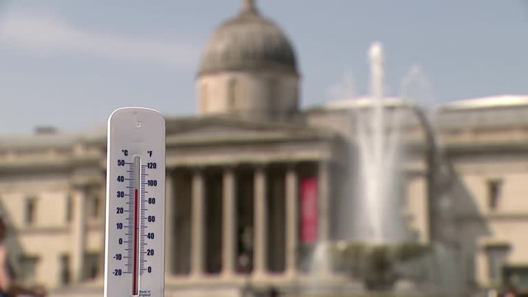 People Seek Respite From Heat In London's Trafalgar Square As Temperatures Soar