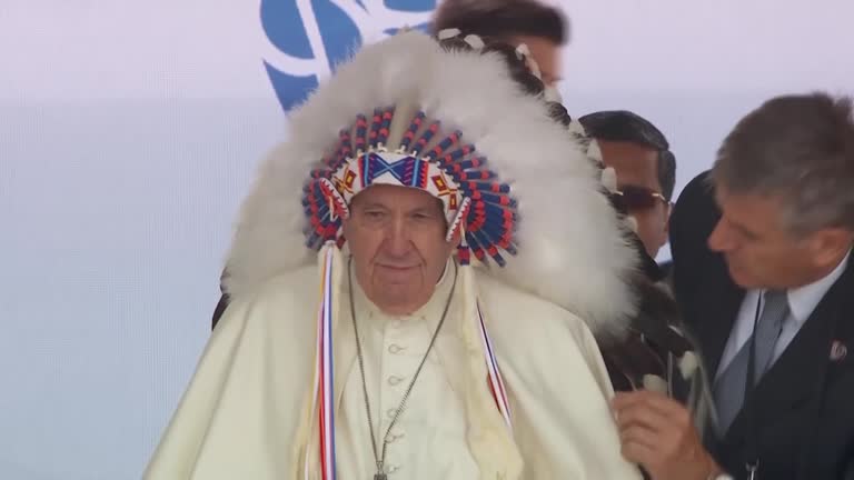 Moment: Indigenous Leader Places Headdress On Pope Francis