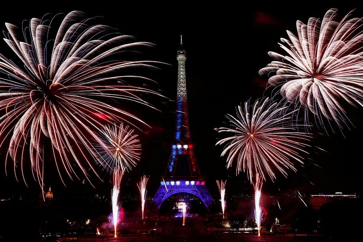 Fireworks Explode Around The Eiffel Tower During Celebrations To Mark Bastille Day, In Paris