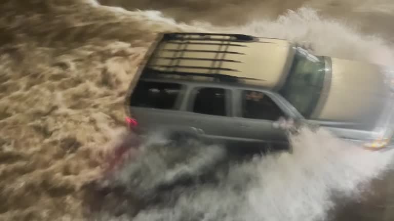 Drivers Navigate Through Flooded Streets In Fort Worth, Texas